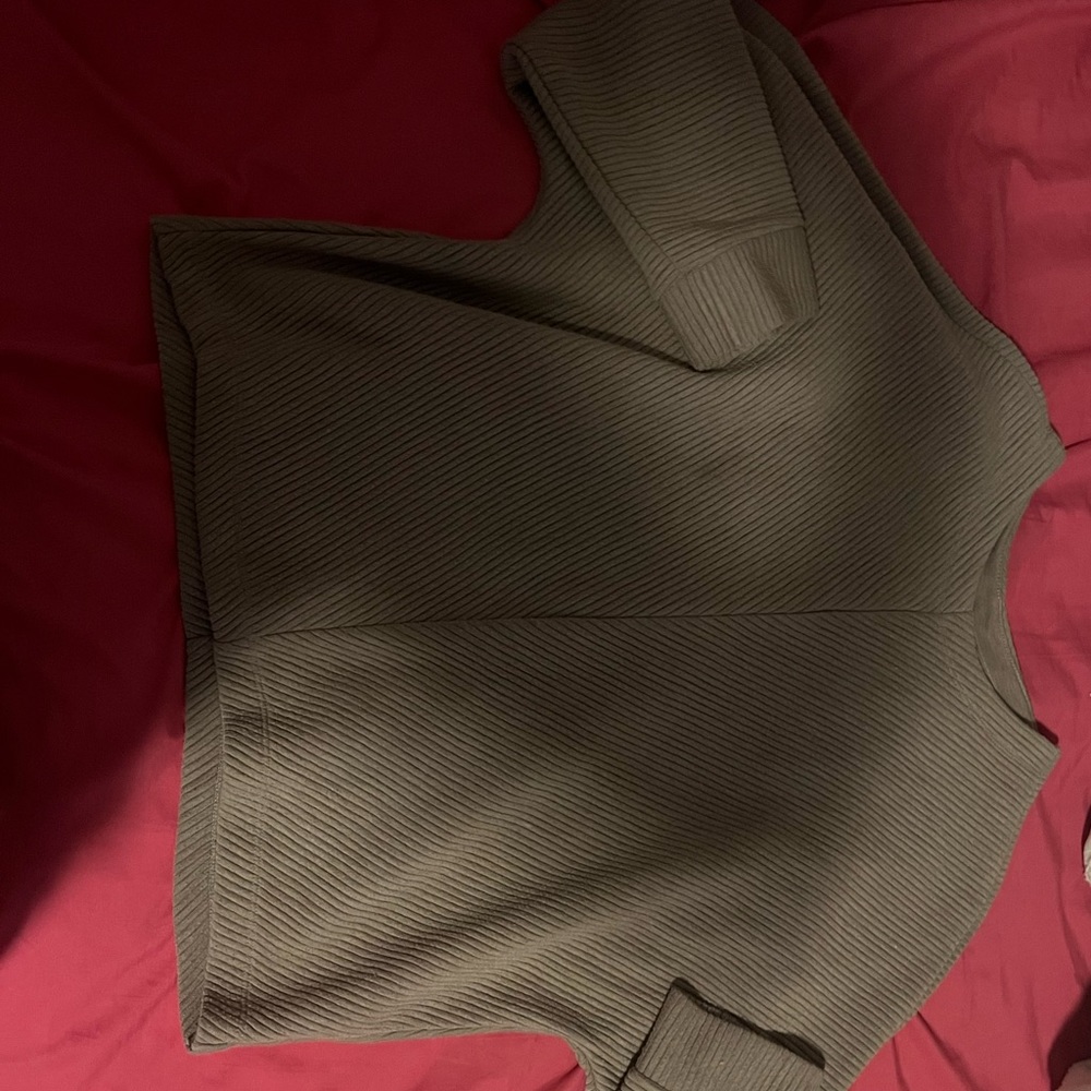 Brown textured sweater.